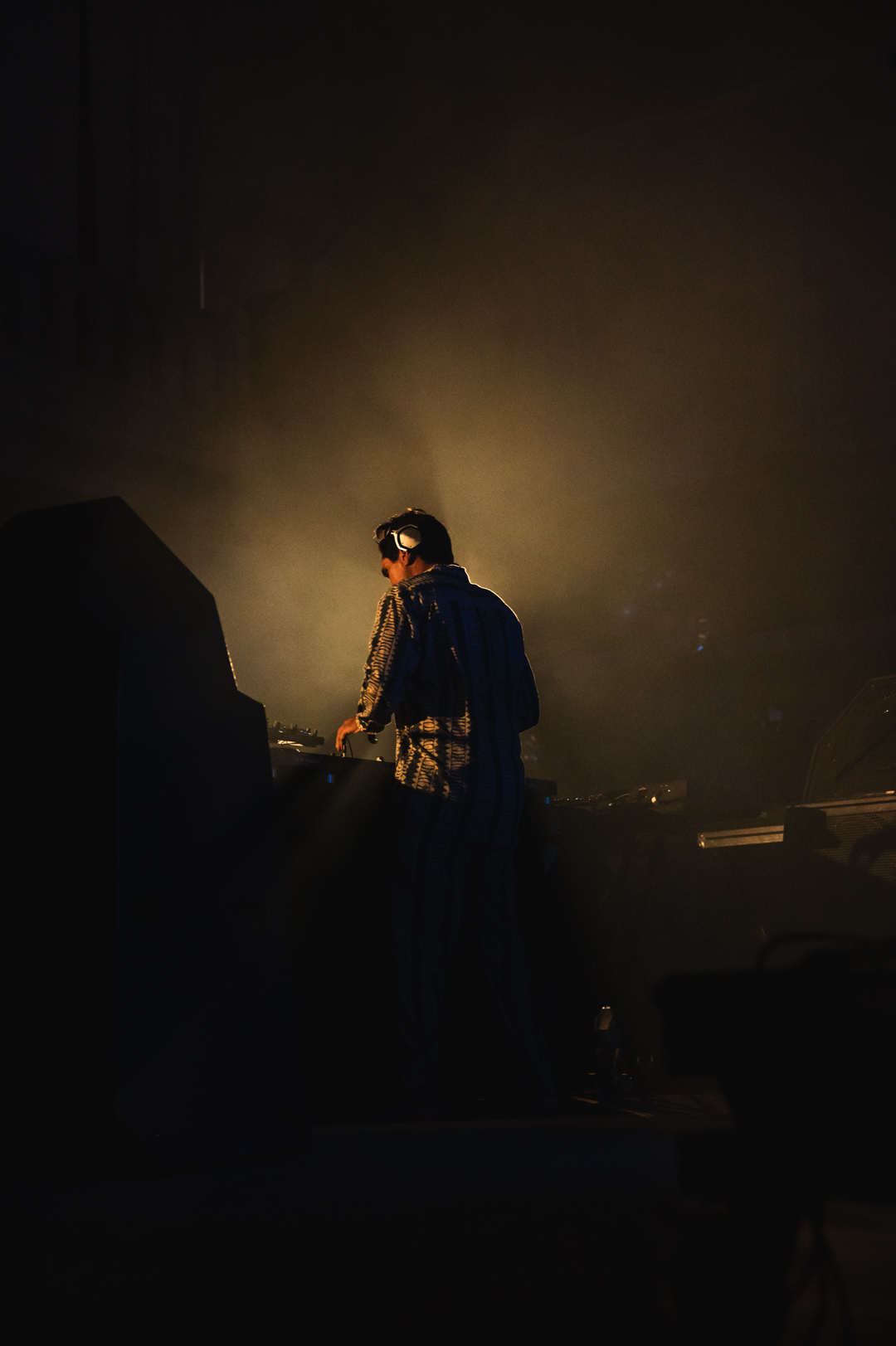 DJ silhouette in amber light