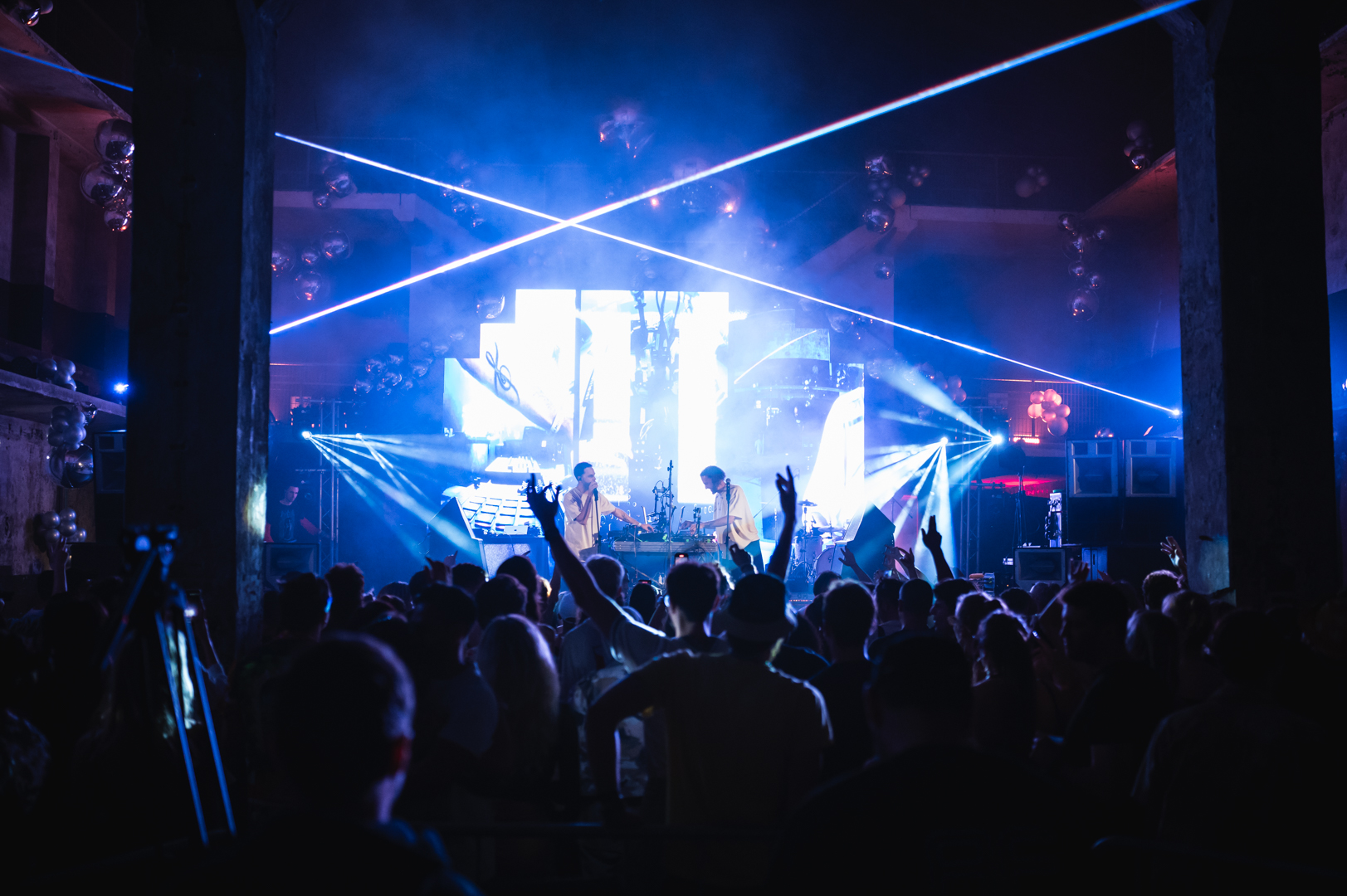 Stage with blue lasers and crowd