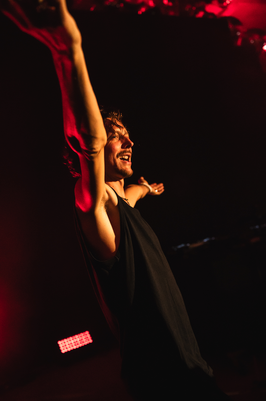 Artist performing in red light