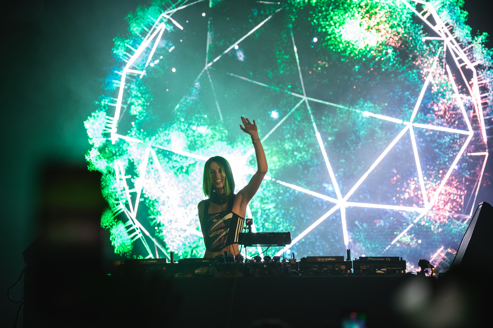 Fantazia Music Festival - DJ performing with green geometric visuals